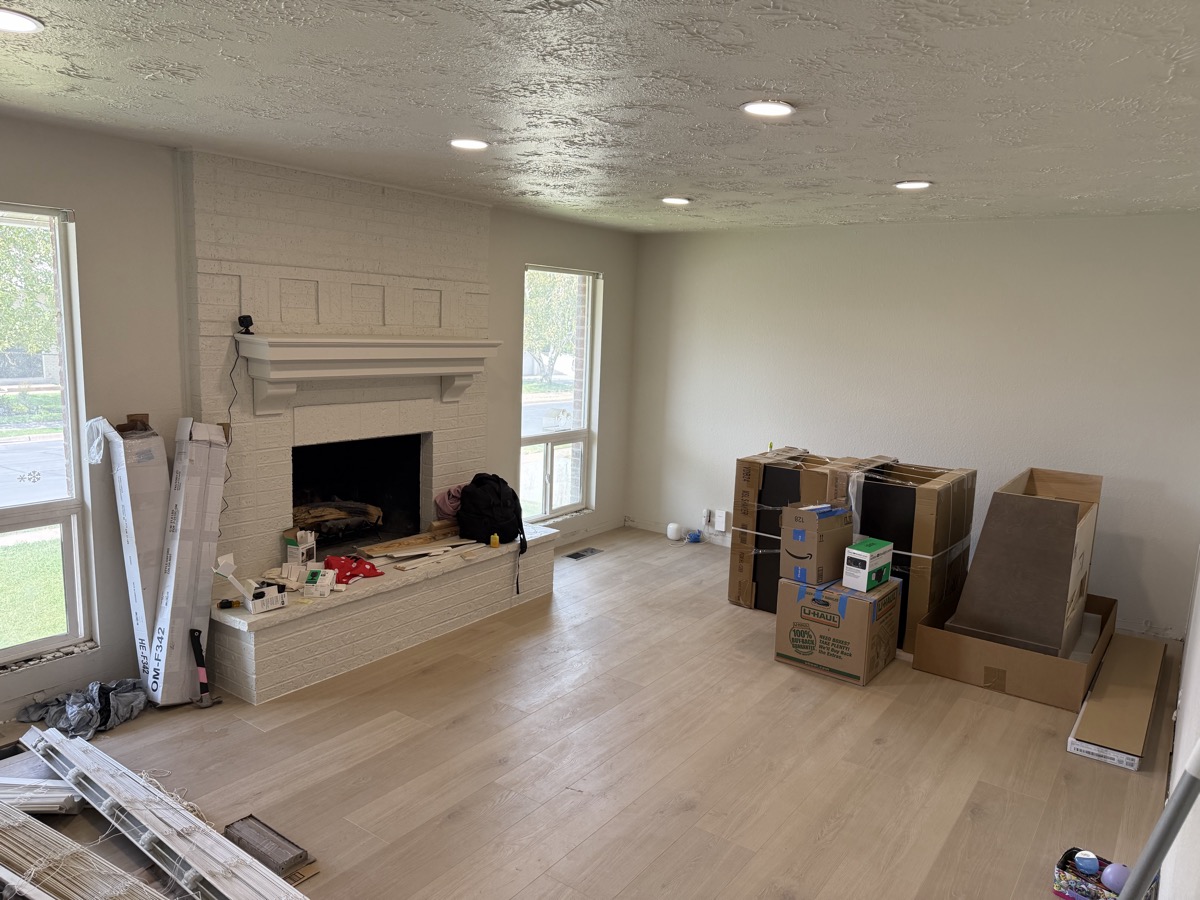 Living room after — fresh paint and trim