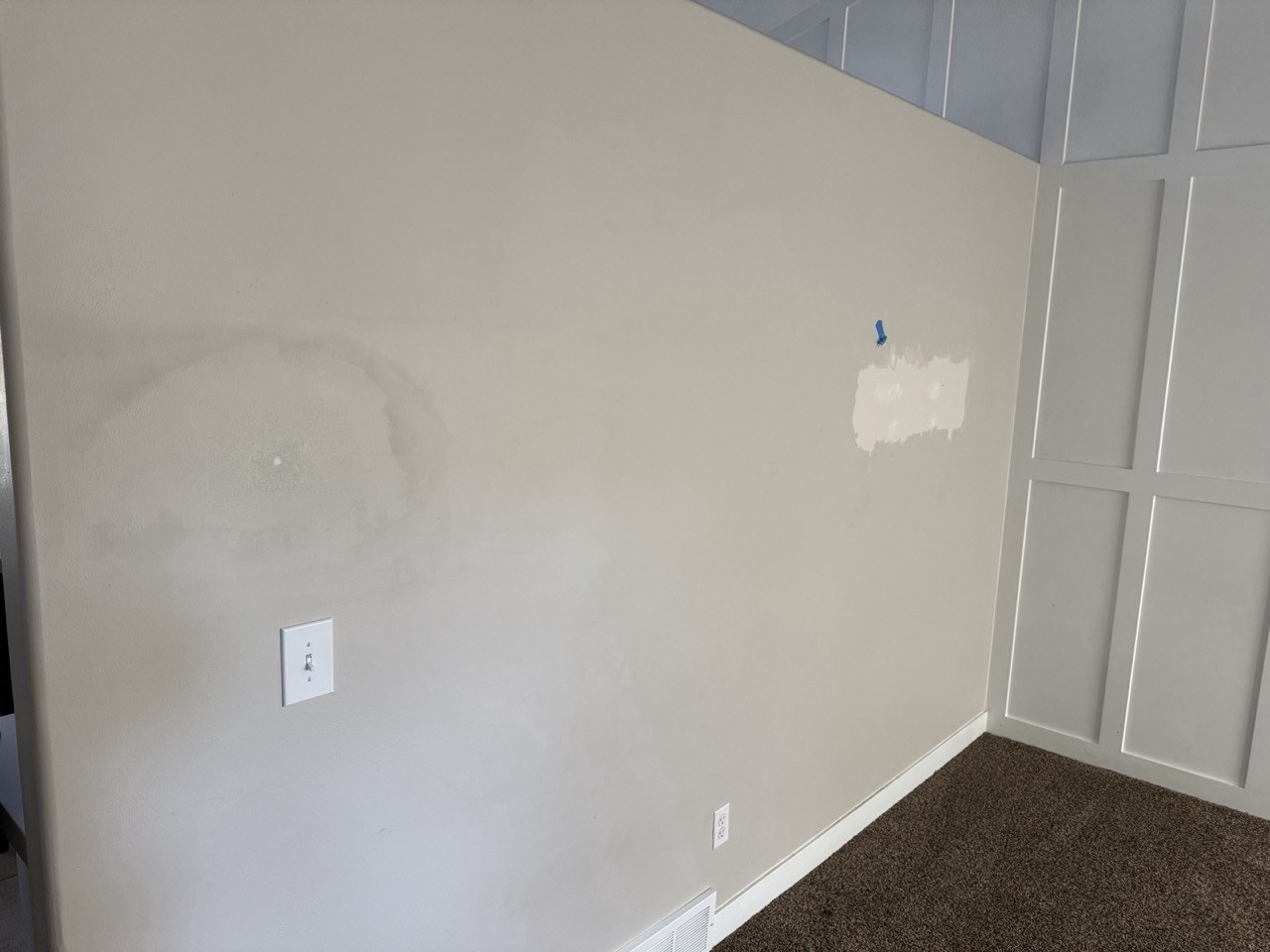 Water-stained wall patched and primed, ready for finish paint